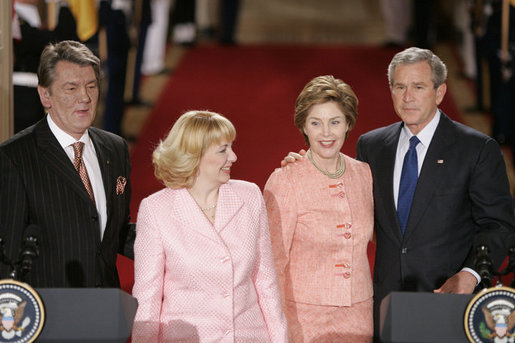 President George W. Bush and Ukraine President Viktor Yushchenko are joined at the podiums by first ladies Laura Bush and Kateryna Yushchenko Monday, April 4, 2005, in the East Room of the White House.White House photo by Paul Morse