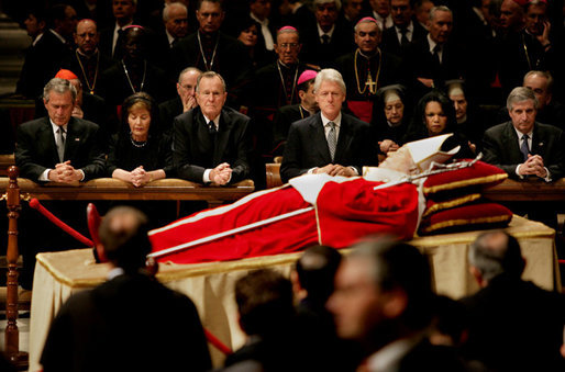 Pictured from left, President George W. Bush, Laura Bush, former President George H. W. Bush, former President Bill Clinton, Secretary of State Condoleezza Rice and White House Chief of Staff Andy Card pay their respects to Pope John Paul II as he lies in state in St. Peter's Basilica at the Vatican Wednesday, April 6, 2005. White House photo by Eric Draper