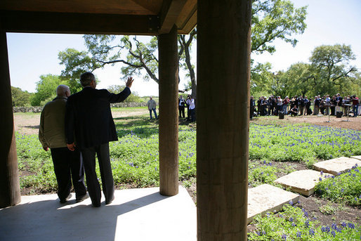 President George W. Bush and Israeli Prime Minister Ariel Sharon wave to the press while meeting at the President's Ranch in Crawford, Texas, Monday, April 11, 2005. White House photo by David Bohrer