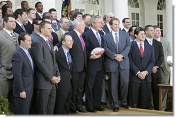 President George W. Bush poses with the New England Patriots during a ceremony honoring the 2005 Super Bowl Champions in the Rose Garden April 13, 2005.  White House photo by Eric Draper