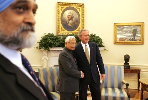  President George W. Bush greets Natwar Singh, External Affairs Minister of India, in the Oval Office of the White House, Thursday, April 14, 2005. At left is Monteq Ahluwalia, Deputy Chairman of India's Planning Commission. White House photo by Krisanne Johnson