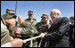 Vice President Dick Cheney poses for photos with troops during a visit to McGuire in New Jersey Friday, April 15, 2005. White House photo by David Bohrer