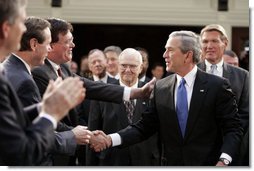 President George W. Bush greets South Carolina legislators upon his arrival to the State House in the state capitol Monday, April 18, 2005. White House photo by Paul Morse