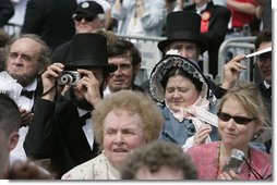 One of the many Lincoln look-alikes attending the dedication of the Abraham Lincoln Presidential Library and Museum captures a few memories for himself in Springfield, Ill., Tuesday, April 19, 2005.  White House photo by Eric Draper