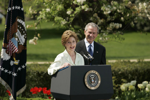 President George W. Bush looks on as he's introduced by First Lady Laura Bush Wednesday, April 20, 2005, to honor the 2005 National Teacher of the Year during ceremonies in the Rose Garden. Jason Kamras, a math teacher of eight years at John Philip Sousa Middle School in Washington, D.C., received the honors. White House photo by Krisanne Johnson