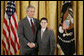 President George W. Bush congratulates James Quadrino, Jr., 13, of the Elias Bernstein School on Staten Island, N.Y., on receiving the President’s Environmental Youth Award in the East Room of the White House April 21, 2005. White House photo by Paul Morse