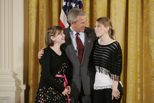 President George W. Bush congratulates eighth grade students of 2004 from Grant Community Middle School in Salem, Ore., on receiving the President’s Environmental Youth Award in the East Room of the White House April 21, 2005. Members include, from left to right, Alyssa Foster, 15, and Amber Urban, 15. White House photo by Paul Morse