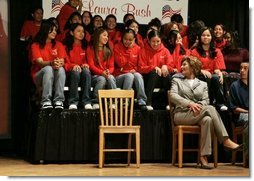 Laura Bush talks with middle school students on stage prior to delivering remarks at Sun Valley Middle School in Sun Valley, Calif., April 27, 2005.  White House photo by Krisanne Johnson