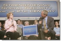 President George W. Bush talks with Colleen Rummel during a conversation on Social Security at the James Lee Community Center, Falls Church, Va., Friday, April 29, 2005.  White House photo by Paul Morse