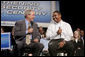 President George W. Bush talks with Yuctan Hodge, 24, during a conversation on Social Security at the James Lee Community Center, Falls Church, Va., Friday, April 29, 2005. White House photo by Paul Morse