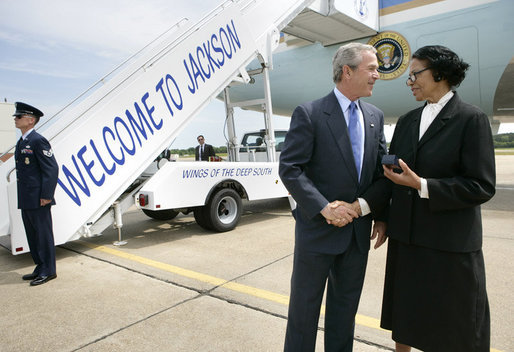 President George W. Bush meets Freedom Corps Greeter Ruth Wilson at Mississippi Air National Guard Base, Tuesday, May 3, 2005. Wilson developed a leadership training program at Mount Wade Missionary Baptist Church in Terry, Mississippi, to identify and meet needs within the community. White House photo by Eric Draper