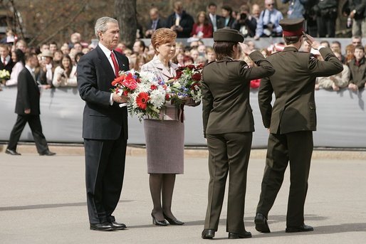 President George W. Bush and Latvia's President Vaira Vike-Freiberga participate in a wreath-laying ceremony in front of the Freedom Monument in Riga, May 7, 2005. White House photo by Paul Morse