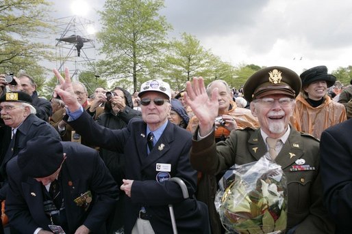 World War II veterans acknowledge President and Mrs. Bush Sunday, May 8, 2005, during a celebration at the Netherlands American Cemetery in Margraten, in remembrance of those who served during World War II. White House photo by Eric Draper