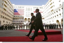 President George W. Bush walks with President Mikhail Saakashvili during an arrival ceremony in the courtyard of the Parliament Building in Tbilisi, Georgia, Tuesday, May 10, 2005.  White House photo by Paul Morse
