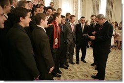 President George W. Bush talks with members of the Indiana University men's soccer team in the State Dining Room before a ceremony celebrating the 2005 NCAA champions Friday, May 13, 2005.  White House photo by Eric Draper