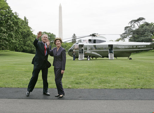 President George W. Bush and Laura Bush wave to the NCAA champions on the Truman balcony before departing the South Lawn en route Camp David Friday, May 13, 2005. White House photo by Paul Morse