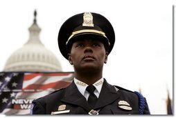 A police officer stands in front of the U.S. Capitol during the Annual Peace Officer's Memorial Service on Sunday, May 15, 2005. White House photo by Krisanne Johnson