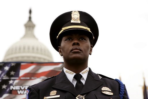 A police officer stands in front of the U.S. Capitol during the Annual Peace Officers' Memorial Service on Sunday, May 15, 2005. White House photo by Krisanne Johnson