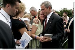 President George W. Bush shares a quiet moment with guests after the Annual Peace Officer's Memorial Service at the U.S. Capitol on Sunday, May 15, 2005. White House photo by Krisanne Johnson