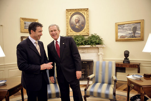 President George W. Bush talks with Prime Minister Anders Fogh Rasmussen of Denmark in the Oval Office Friday, May 20, 2005. White House photo by Eric Draper