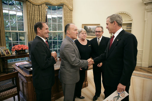 President George W. Bush meets with representatives of the Cuban-American Community in the Oval Office to discuss pro-democracy efforts in Cuba Friday, May 20, 2005. Pictured are, from left: Eleno Oviedo of Sunrise, Fla.; Luis Zuniga of Miami; Caridad Roque of Miami; and Emilio Estefan of Miami. White House photo by Eric Draper