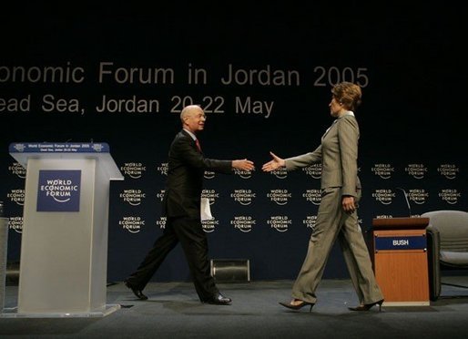 Klaus Schwab, chairman and founder of the World Economic Forum, welcomes Laura Bush to speak at the World Economic Forum at the Dead Sea in Jordan Saturday, May 21, 2005. White House photo by Krisanne Johnson