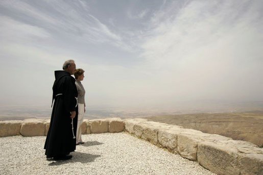 Laura Bush and Father Michele Piccirillo, head of the Franciscan Archeology Society, look out from the Judeo-Christian holy site of Mount Nebo in Jordan Saturday, May 21, 2005. White House photo by Krisanne Johnson