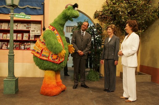 Laura Bush and Suzanne Mubarak, wife of Egyptian President Hosni Mubarak, right, meet children’s television character Nimnim, left, and Amr Koura, CEO of Alkarma Endutainment, before taking a segment for the “Alam Simsim” show in Cairo, Egypt, May 23, 2005. The program offers educational curriculum in an inventive way that puts fun into learning for Egyptian children. White House photo by Krisanne Johnson