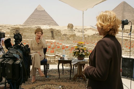 Press Secretary Susan Whitson talks with Laura Bush between television interviews in front of the Giza Pyramids in Giza, Egypt, Monday, May 23, 2005. White House photo by Krisanne Johnson