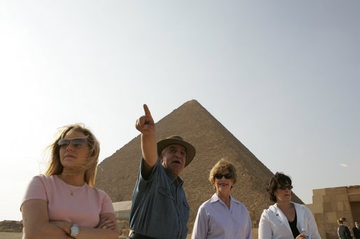 Dr. Zahi Hawass, secretary general of the Supreme Council of Antiquities, shows Liz Cheney, left, Laura Bush and Anita McBride, chief of staff for Mrs. Bush, right, the Giza Pyramids and a new excavation site in Giza, Egypt, Monday, May 23, 2005. White House photo by Krisanne Johnson