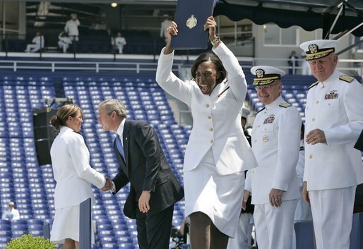 A U.S. Naval Academy graduate yells for joy after receiving her diploma in Annapolis, Md., Friday, May 27, 2005. White House photo by Paul Morse