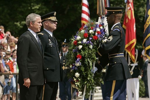 President George. W. Bush stands with U.S. Army Major General Galen Jackman as he lays a wreath at the Tomb of the Unknown Soldier at the Arlington National Cemetery on Memorial Day May 30, 2005. White House photo by Krisanne Johnson