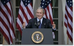 President George W. Bush smiles as he responds to a reporter's question Tuesday morning, May 31, 2005, during a press availability in the Rose Garden of the White House. White House photo by Eric Draper