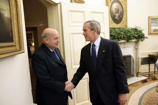 President George W. Bush welcomes Dr. Jose Miguel Insulza, Secretary General of the Organization of American States, to the Oval Office of the White House Tuesday, May 31, 2005. The former Chilean interior minister assumed the OAS office May 26, 2005. White House photo by Eric Draper