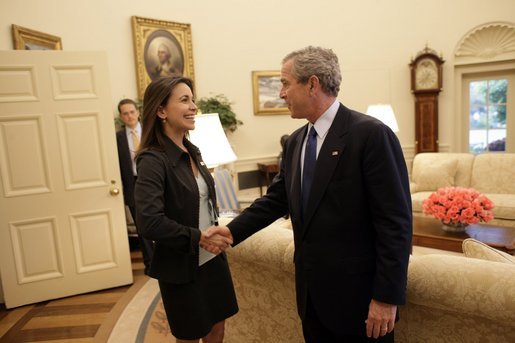 President George W. Bush welcomes Maria Corina Machado, the founder and executive director of Sumate, an independent democratic civil society group in Venezuela, to the Oval Office Tuesday, May 31, 2005. Sumate was established in January 2002 as a non-governmental organization to defend the electoral and constitutional rights of all Venezuelan citizens and to monitor and report on the performance of Venezuela's electoral institutions. White House photo by Eric Draper