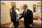 President George W. Bush welcomes Maria Corina Machado, the founder and executive director of Sumate, an independent democratic civil society group in Venezuela, to the Oval Office Tuesday, May 31, 2005. Sumate was established in January 2002 as a non-governmental organization to defend the electoral and constitutional rights of all Venezuelan citizens and to monitor and report on the performance of Venezuela's electoral institutions. White House photo by Eric Draper