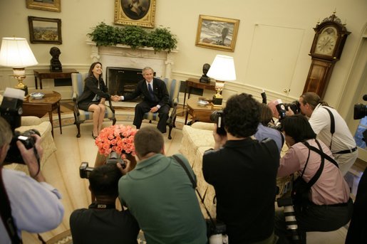 President George W. Bush meets with Maria Corina Machado in the Oval Office of the White House Tuesday, May 31, 2005. Ms. Machado is the founder and executive director of Sumate, an independent democratic civil society group in Venezuela. White House photo by Eric Draper