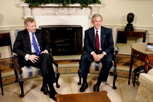 President George W. Bush and Jaap de Hoop Scheffer, Secretary General of NATO, sit for the media in the Oval Office of the White House Wednesday, June 1, 2005. White House photo by Paul Morse