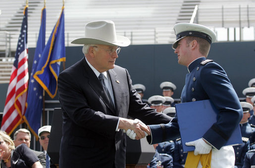 Vice President Dick Cheney shakes hands with Andrew Sellers, the first graduate to receive his diploma in the U.S. Air Force Academy Class of 2005, during the commencement ceremony in Colorado on Wednesday, June 1, 2005. The graduate was deemed the outstanding cadet for academic performance, military performance and in the field of computer science. White House photo by David Bohrer