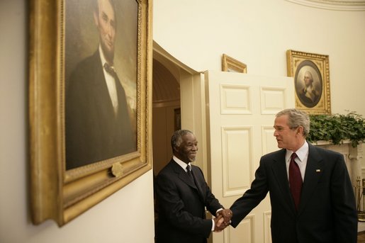 President George W. Bush welcomes President Thabo Mbeki of South Africa, to the Oval Office of the White House Wednesday, June 1, 2005. White House photo by Eric Draper