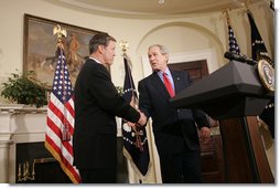 President George W. Bush shakes the hand of Christopher Cox (R-Calif.) after introducing him Thursday, June 2, 2005, as his nominee for Chairman of the Securities and Exchange Commission. White House photo by Paul Morse