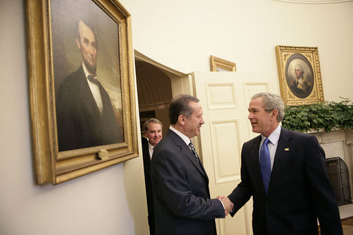 President George W. Bush welcomes Prime Minister Recep Tayyip Erdogan of Turkey to the Oval Office Wednesday, June 8, 2005. "Turkey's democracy is an important example for the people in the broader Middle East, and I want to thank you for your leadership," said the President in his remarks during the two leaders' meeting with the press. White House photo by Eric Draper