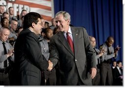 President George W. Bush thanks Attorney General Alberto Gonzales after speaking about the Patriot Act at the Ohio State Highway Patrol Academy in Columbus, Ohio, Thursday, June 9, 2005.  White House photo by Eric Draper