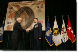 Vice President Dick Cheney awards U.S. Air Force Major Matthew R. Glover the Distinguished Flying Cross during the Heroism Awards Ceremony at the Davis Conference Center, MacDill Air Force Base, in Tampa, Fla., Friday, June 10, 2005. White House photo by David Bohrer