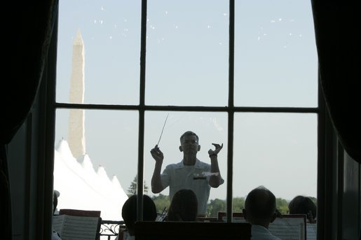 Lt. Col. Michael J. Colburn, USMC, conducts "The President's Own" United States Marine Band during the Congressional Picnic on the South Lawn Wednesday, June 15, 2005. White House photo by Paul Morse
