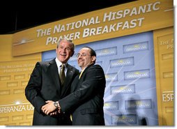 President George W. Bush is thanked by Reverend Danny Cortes after speaking at the National Hispanic Prayer Breakfast at the Andrew Mellon Auditorium in Washington, D.C., Thursday, June 16, 2005.  White House photo by Eric Draper
