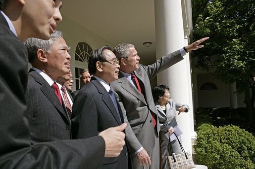 After meeting in the Oval Office, President George W. Bush shows Vietnamese Prime Minister Phan Van Khai and his delegation the Rose Garden during their visit to the White House Tuesday, June 21, 2005. It is the first visit by a Prime Minister from Vietnam in more than 30 years. White House photo by Eric Draper
