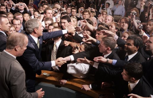 President George W. Bush reaches out to the crowd Thursday, June 23, 2005, after a Conversation on Strengthening Social Security at Montgomery Blair High School in Silver Spring, Maryland. White House photo by Paul Morse