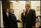 President George W. Bush shakes the hand of Iraq's Prime Minister Ibrahim Jaafari as he and U.S. Ambassador Donald Ensenat welcome the Prime Minister to the Oval Office Friday, June 24, 2005. Interpreter Gamal Helal stands in background. White House photo by Eric Draper