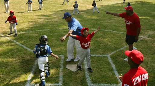 Everyone's on the move as the Memphis Red Sox from Chicago score against the Black Yankees of Newark during "Tee Ball on the South Lawn" Sunday, June 26, 2005. White House photo by Paul Morse